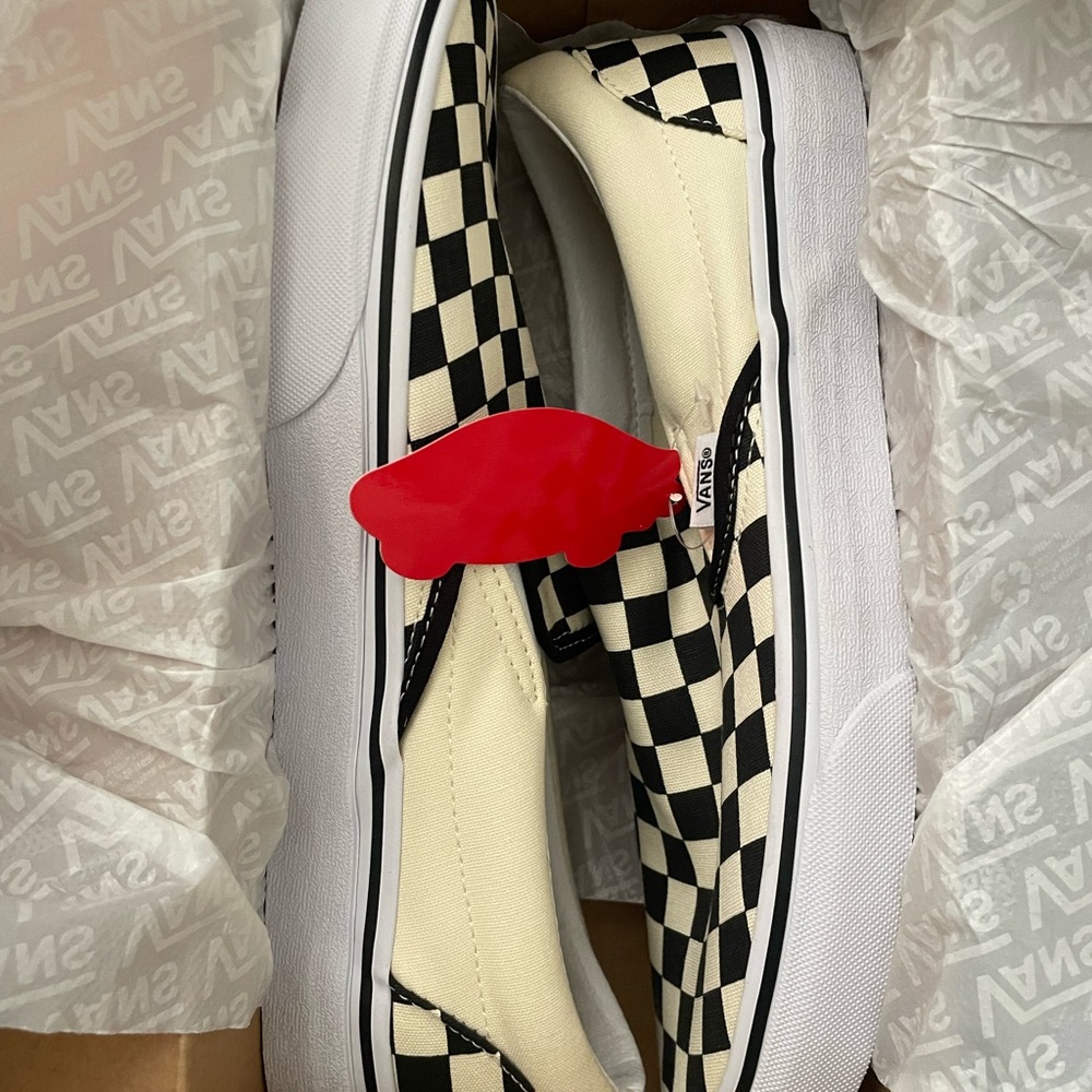 Black and white checkered Vans. Never worn.